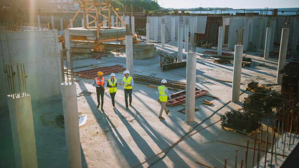 Civil engineers walking through building site